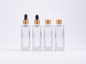 Preview: Klarglasflasche Miro 100ml - Pipette gold